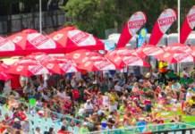 EXPAND A SIGN KEEPS CRICKET FANS COVERED