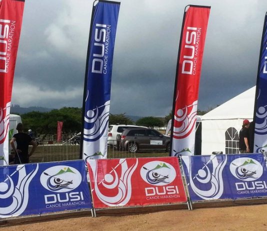 EXPAND A SIGN SUPPORTS DUSI CANOE MARATHON